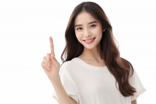 指を立てる女性